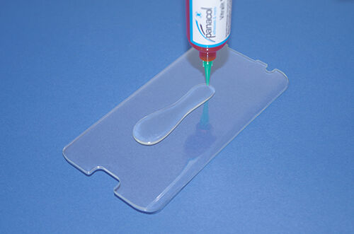 optically clear adhesive for displays is beeing dispensed on display protection