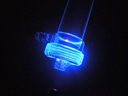 two elements of a plastic dialysis filter bonded with fluorescent adhesive from Panacol
