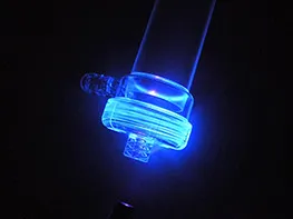 two elements of a plastic dialysis filter bonded with fluorescent adhesive from Panacol