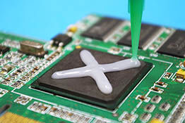 Thermally conductive adhesive from Panacol on electronic components for heat sinks