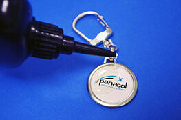 Dome coating with transparent adhesive on key ring